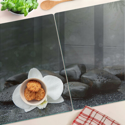 Szklana deska do krojenia Kwiat orchidei na kamieniach