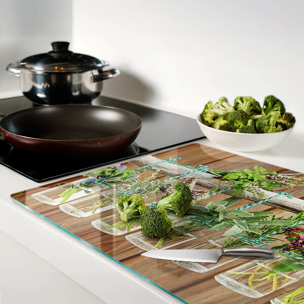 Szklana deska kuchenna Zioła w słoikach na tle drewna