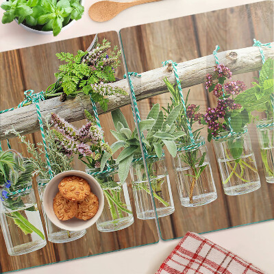 Szklana deska kuchenna Zioła w słoikach na tle drewna