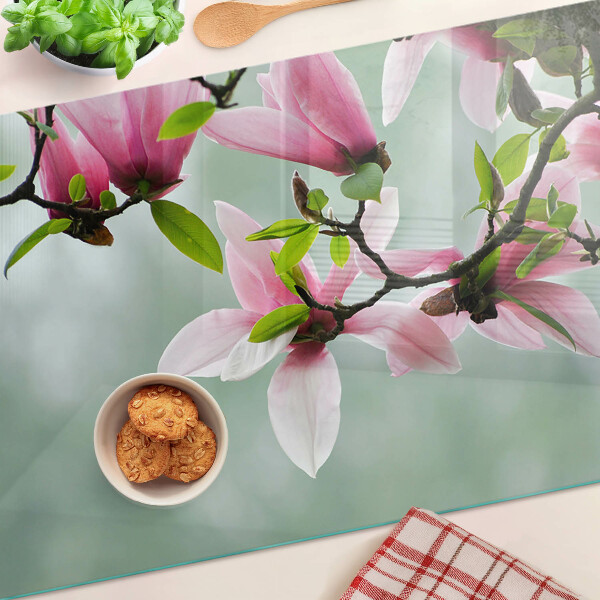 Szklana deska do krojenia Kwiaty magnolii na tle zieleni