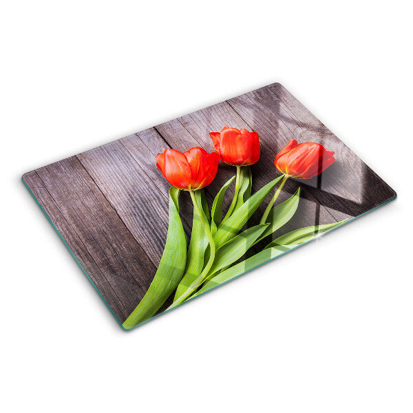 Glazen snijplanken Tulpen op een houten achtergrond