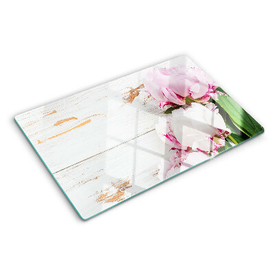 Snijplanken van glas Pioenrozen op een houten achtergrond