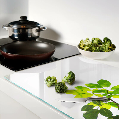 Szklana deska do krojenia Liście na tle jasnego nieba