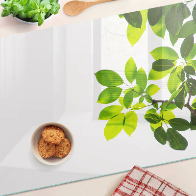 Szklana deska do krojenia Liście na tle jasnego nieba