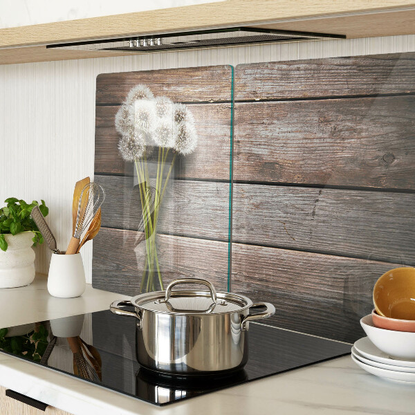 Szklana deska kuchenna Kwiaty dmuchawce na drewnianym tle