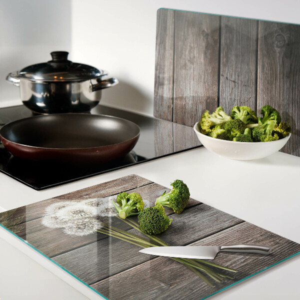 Szklana deska kuchenna Kwiaty dmuchawce na drewnianym tle