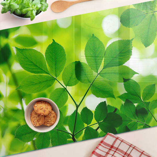 Deska kuchenna szklana Liście na zielonym tle