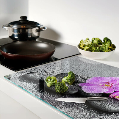 Szklana deska do krojenia Kwiaty i kamienie na tle wody