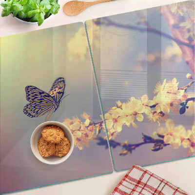 Glazen snijplanken Vlindermotief op een bloemenachtergrond