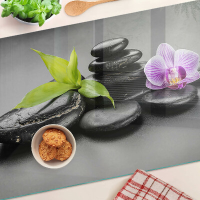 Deska kuchenna szklana Kamienie i orchidea na tle