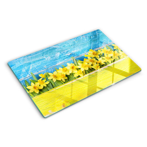 Szklana deska kuchenna Kwiaty żonkili na tle nieba