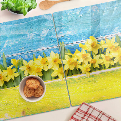 Szklana deska kuchenna Kwiaty żonkili na tle nieba