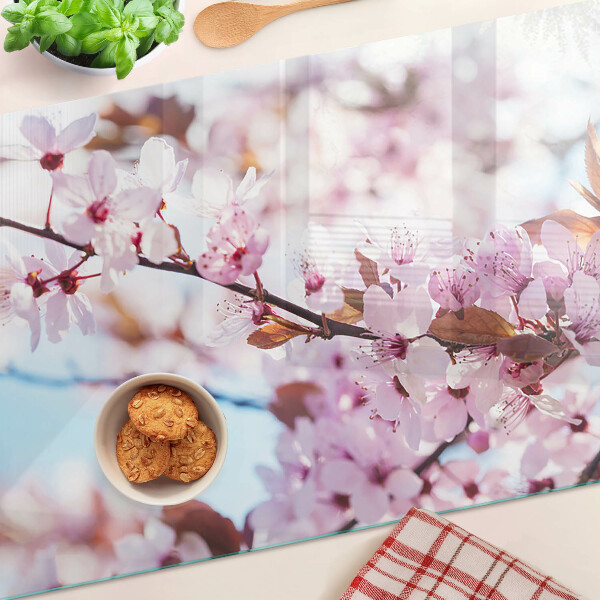 Glazen snijplanken Kersenbloesems op een blauwe achtergrond