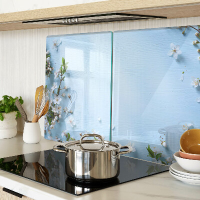 Snijplanken van glas Bloemenpatroon op een blauwe achtergrond