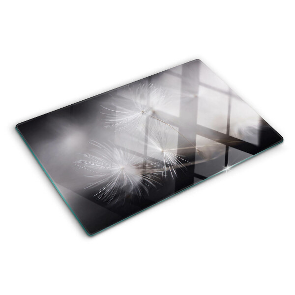 Szklana deska kuchenna Puszyste dmuchawce na tle okna