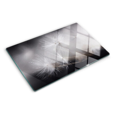 Szklana deska kuchenna Puszyste dmuchawce na tle okna