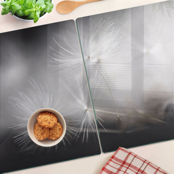 Szklana deska kuchenna Puszyste dmuchawce na tle okna