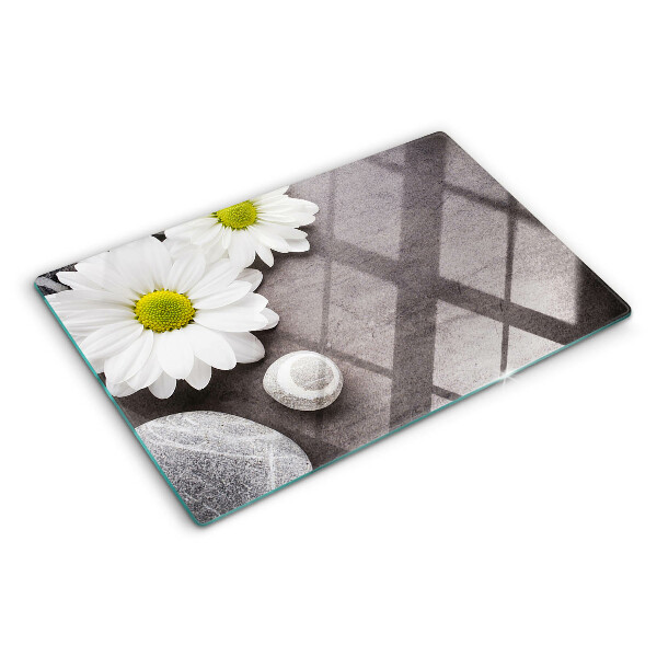 Glazen snijplanken Bloemen en stenen op de achtergrond