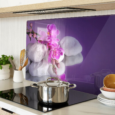 Deska kuchenna szklana Kwiaty orchidei na tle kamieni