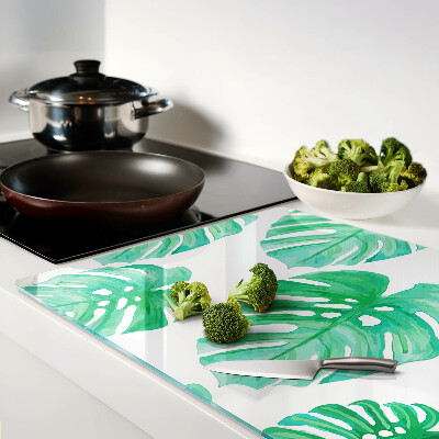 Szklana deska do krojenia Liście monstery na białym tle