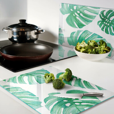 Szklana deska do krojenia Liście monstery na białym tle