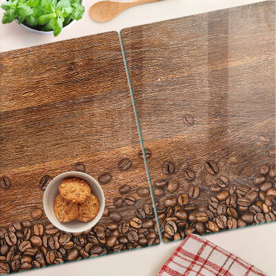 Szklana deska do krojenia Ziarna kawy na drewnianym tle