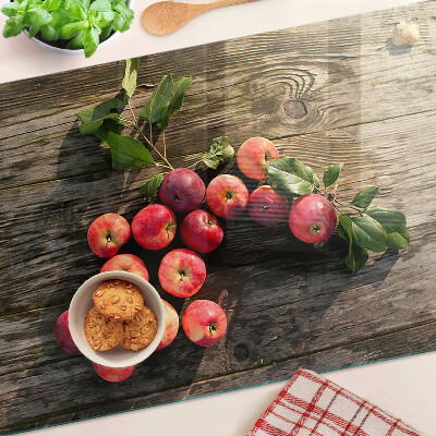 Snijplanken van glas Appels op een houten achtergrond