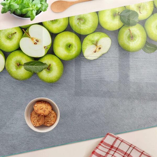 Szklana deska kuchenna Zielone jabłka na szarej powierzchni