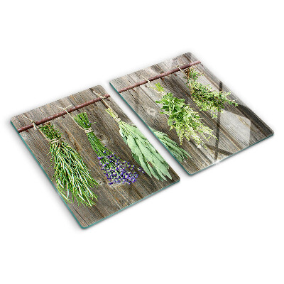 Snijplanken van glas Kruiden op een houten achtergrond