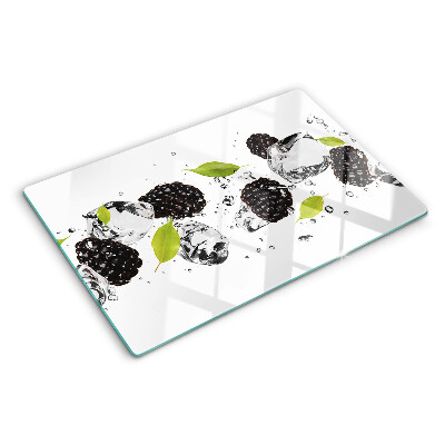 Snijplanken van glas Frambozen met blaadjes en waterdruppels