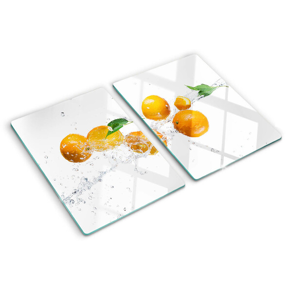 Snijplanken van glas Citrusvruchten met water