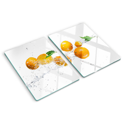 Snijplanken van glas Citrusvruchten met water