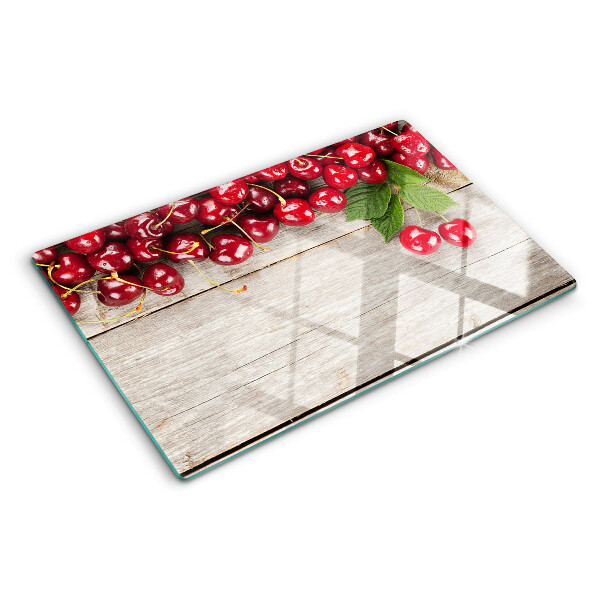 Snijplanken van glas Kersen op een houten achtergrond