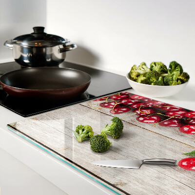 Snijplanken van glas Kersen op een houten achtergrond