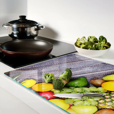 Snijplanken glas Fruit op een houten achtergrond