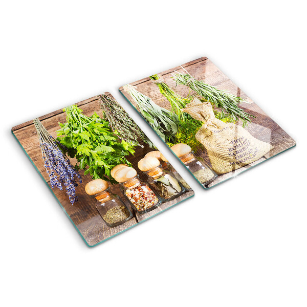 Szklana deska do krojenia Zioła i przyprawy na tle drewna