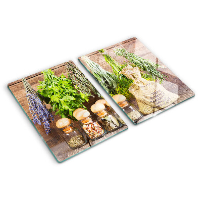 Szklana deska do krojenia Zioła i przyprawy na tle drewna