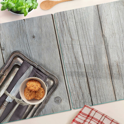 Snijplanken van glas Rustiek bestek op een houten achtergrond