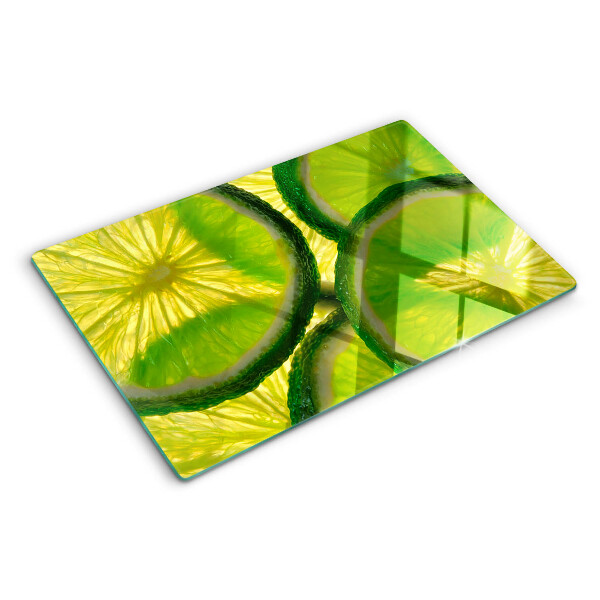 Szklana deska do krojenia Plastry limonki na zielonym tle