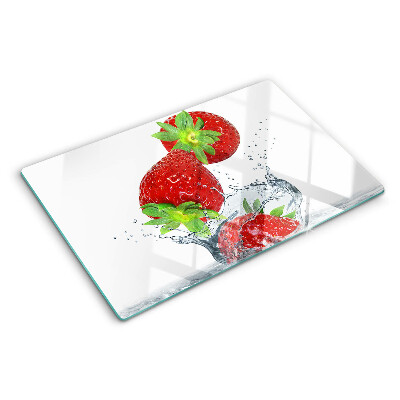 Snijplanken van glas Aardbeien in water