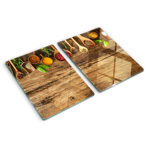 Szklana deska do krojenia Przyprawy i zioła na drewnianym tle