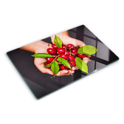 Szklana deska do krojenia Czerwone wiśnie w dłoniach