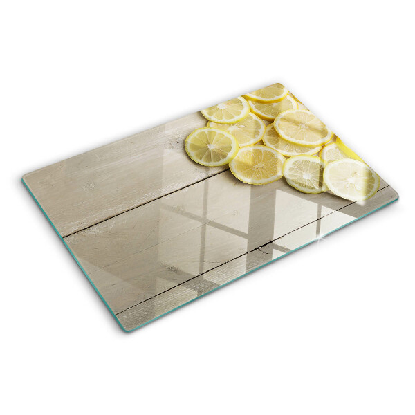 Snijplanken glas Citroenschijfjes op een houten achtergrond