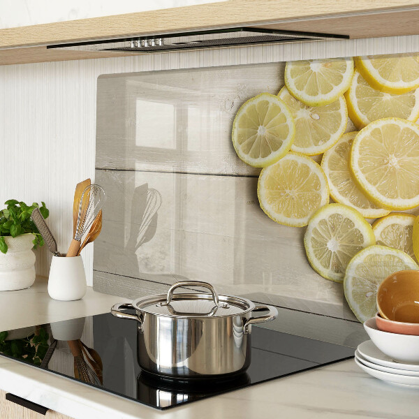 Szklana deska do krojenia Plastry cytryny na drewnianym tle