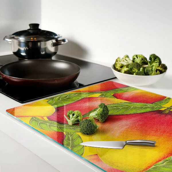 Szklana deska kuchenna Papryki na tle zielonych liści