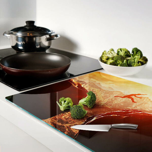 Szklana deska kuchenna Skok w górach przy zachodzie słońca