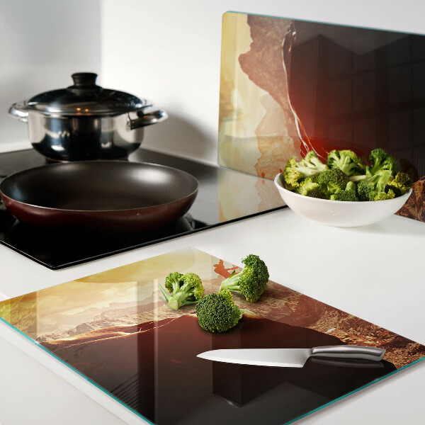 Szklana deska kuchenna Skok w górach przy zachodzie słońca