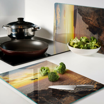 Snijplanken van glas Zonsondergang boven de zee