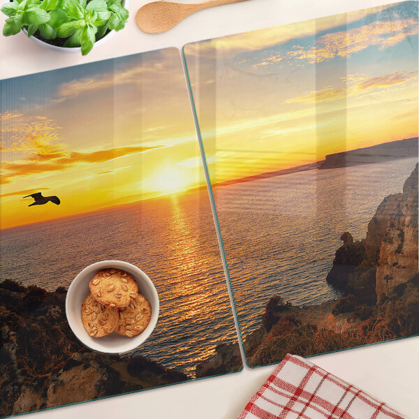 Snijplanken van glas Zonsondergang boven de zee