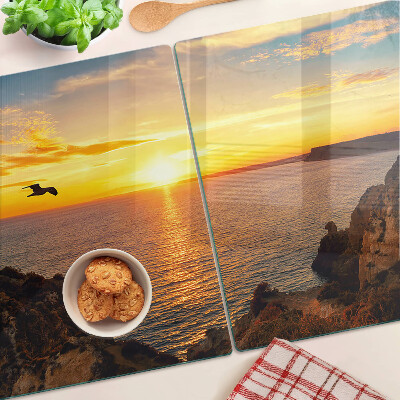 Snijplanken van glas Zonsondergang boven de zee